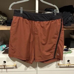 Vuori Men's Athletic Shorts in Rust with Black Accents
